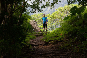 Man looking down a hiking trail