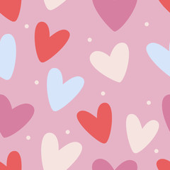Seamless pattern with colorful hearts on pink background. Colored trendy illustration, flat design. Perfect for textile prints and wrapping paper.