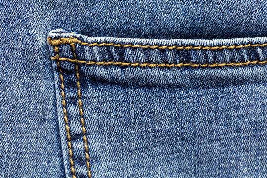 Close up view of blue jeans pocket