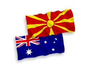 National vector fabric wave flags of Australia and North Macedonia isolated on white background. 1 to 2 proportion.