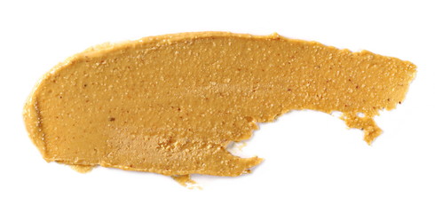 Peanut butter isolated on white background, top view