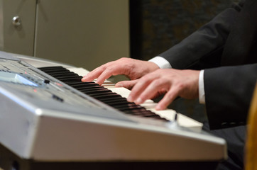 Fototapeta na wymiar Man playing piano