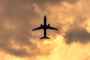 Silhouette of the plane in the sky