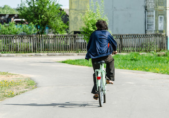 Man riding a bike in the village