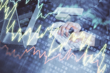 Double exposure of financial graph with man works in office on background. Concept of analysis.