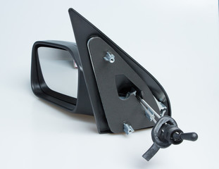 London, England Peugeot 106 1998 left near side wing mirror for cars. Shot on isolated white background with smooth gradient. Car part with adjustable cable, aerodynamics designed for 90's automobile