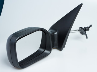 London, England Peugeot 106 1998 left near side wing mirror for cars. Shot on isolated white background with smooth gradient. Car part with adjustable cable, aerodynamics designed for 90's automobile