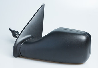 London, England Peugeot 106 1998 left near side wing mirror for cars. Shot on isolated white background with smooth gradient. Car part with adjustable cable, aerodynamics designed for 90's automobile