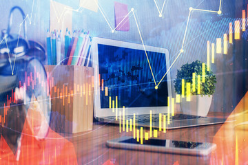 Stock market chart hologram drawn on personal computer background. Multi exposure. Concept of investment.