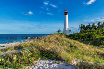 Sunset at Cape Florida Lighthouse on beautiful beach, Miami, Florida, USA