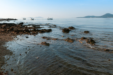 Fototapeta na wymiar View of Adriatic Sea and three boats from Biograd of Croatia, Europe.