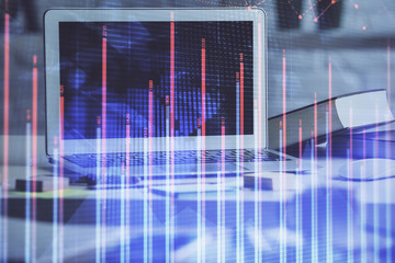 Forex market chart hologram and personal computer background. Multi exposure. Concept of investment.