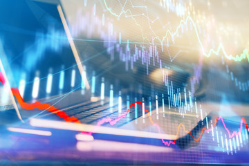 Financial graph colorful drawing and table with computer on background. Multi exposure. Concept of international markets.