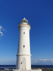 Fototapeta na wymiar lighthouse blue sky background