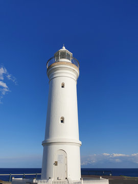 lighthouse blue sky background