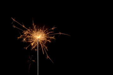 burning sparkler on a black background