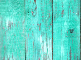 Fototapeta na wymiar texture of bright green vintage wooden fence with peeling paint 