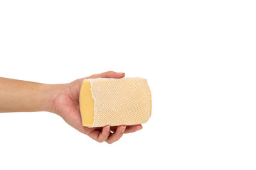 Dirty old yellow dish washer sponge close up, isolated object on white background.