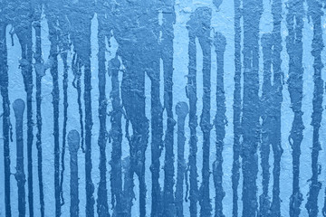 Blue classic color graffiti background on wall in city