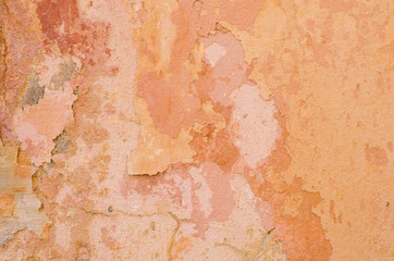 cracked concrete vintage yellow wall background,old wall