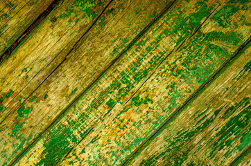 wooden background with peeling green paint