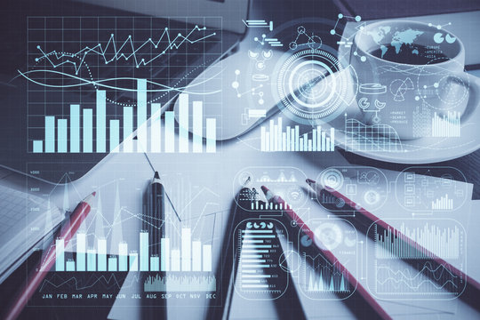 Financial graph colorful drawing and table with computer on background. Multi exposure. Concept of international markets.