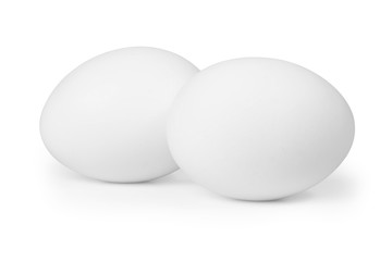 Two white eggs isolated on white background