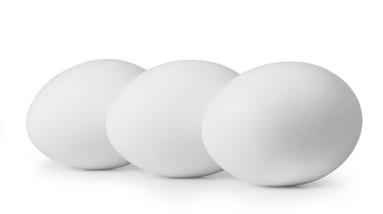 Three white eggs isolated on white background