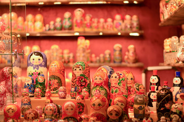 Russian doll art or Matryoshka kept on a store front in a European Christmas market. Also known as Babushka, stacking, nesting dolls or tea dolls are decreasing in size kept inside each other