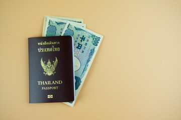 Thailand passport with Japanese banknotes