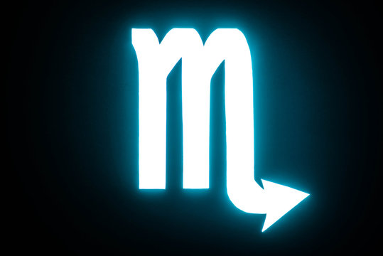 blue illuminated Scorpio zodiac sign isolated on black