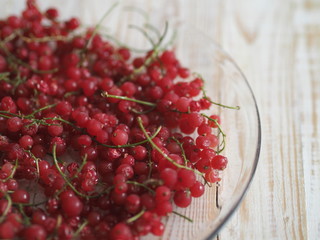 frozen chgoda red currants on a wooden white table