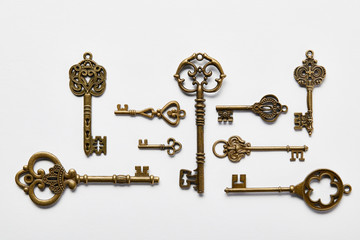top view of vintage keys on white background