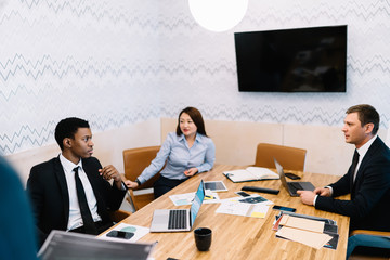 Business people discussing ideas at workplace