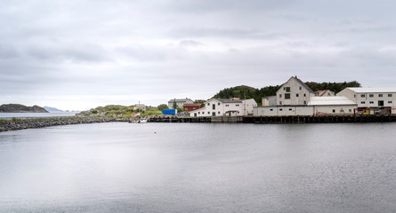 Fototapeta premium dyke and warehouses, Skata, Henningsvaer, Lofoten, Norway