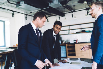 Group of men working in the modern office