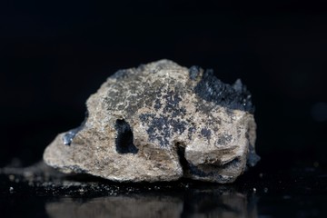 Fototapeta premium Calcium carbide or calcium acetylide with a black background