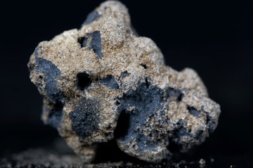 Calcium carbide or calcium acetylide with a black background