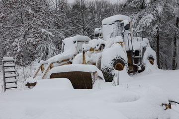 Earth movers in snow