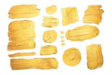 Set di pennellate dorate su sfondo bianco