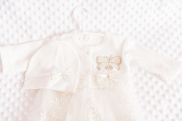 Obraz na płótnie Canvas Cute baby dress on light background for baby girl baptism