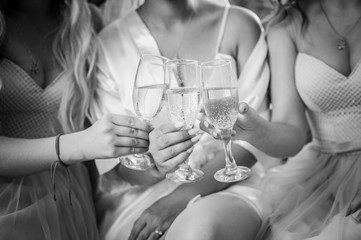 Girls clinking with glasses of champagne