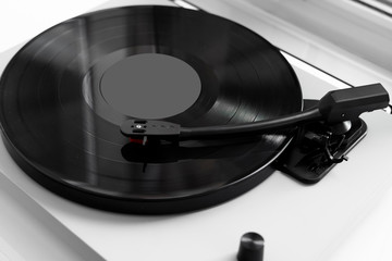 Vinyl turntable on a white background. Retro audio equipment for vinyl disk.