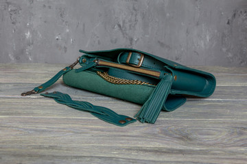 close up of green leather women handbag. Horizontal orientation.