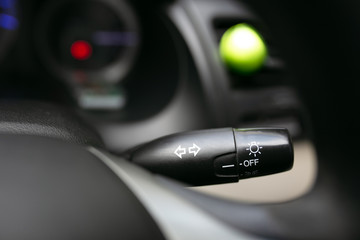 Car component, turn signal, brake light, headlight, speedometer, steering wheel.