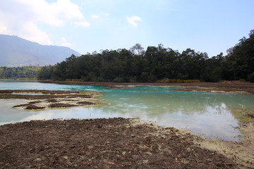 Volcanic sulfur lake telaga warna in Dieng plateau, Central Java Indonesia.  The lake is one mainstay tourist destinations in Wonosobo.