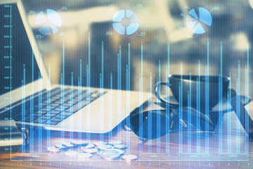 Multi exposure of chart and financial info and work space with computer background. Concept of...
