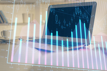 Stock market graph and table with computer background. Double exposure. Concept of financial analysis.