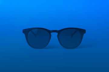Black vintage sunglasses in Color of the year 2020 Classic Blue background
