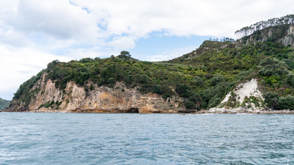 Fototapeta premium View of sea caves from Te Whanganui-A-Hei Cathedral Cove Marine Reserve in Coromandel Peninsula, New Zealand